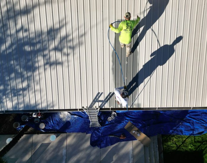 spraying elastomeric coating on metal roof in tucson az